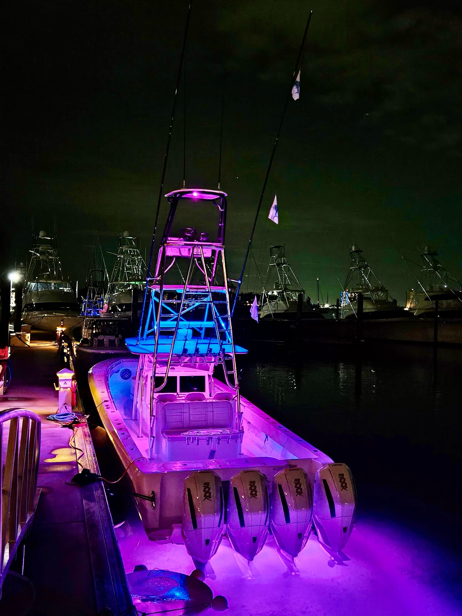 Purple and blue lights lighting a boat - Aventura boats