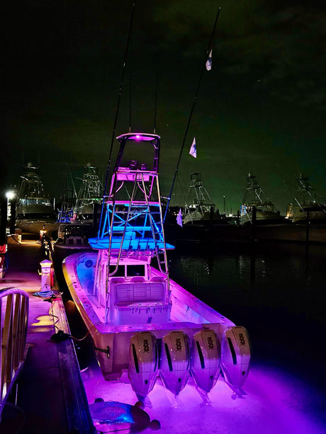 Purple and blue lights lighting a boat - Aventura boats