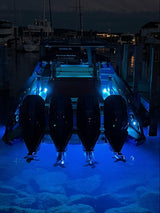 SUPRA SMX54 Surface Mount Underwater Light at night on center console.
