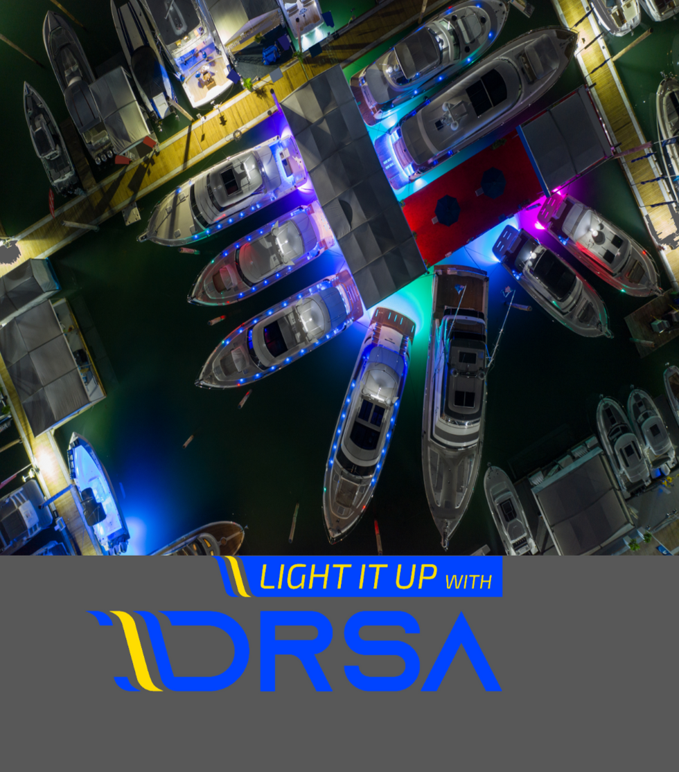 Top-down view of boats with colorful lights and IDRSA logo at the bottom.
