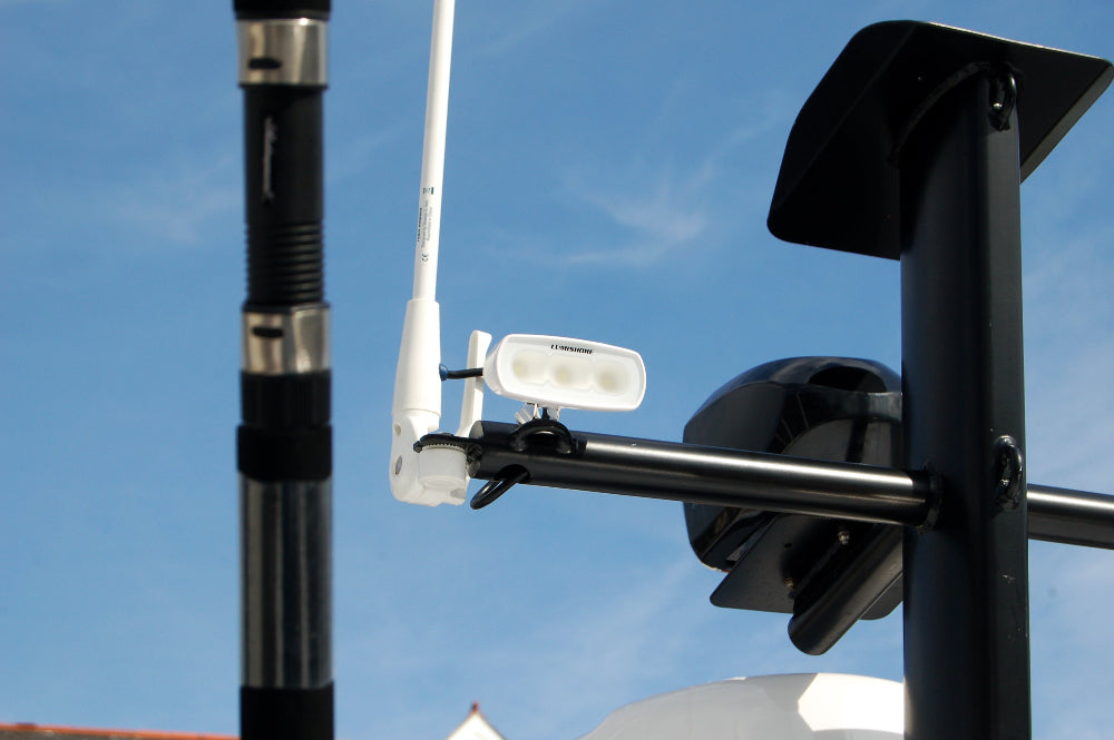 RGBW marine LED flood light mounted on boat mast blck