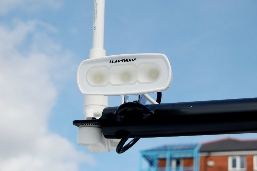 RGBW marine LED flood light mounted on boat white
