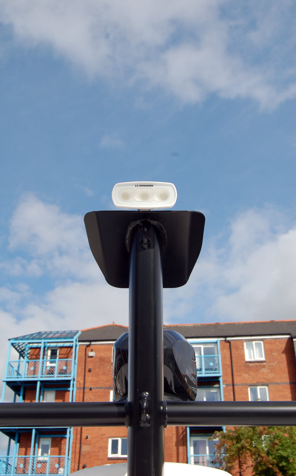 RGBW marine LED flood light mounted on boat mast in white