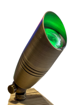 Brass MR16 12V outdoor spot light with bronze finish and spike mount green led on wood
