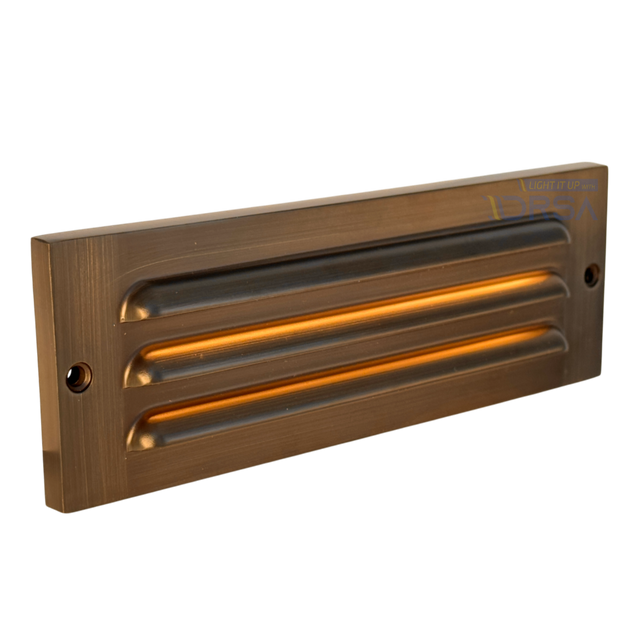 Antique brass LED step light with louvered faceplate


