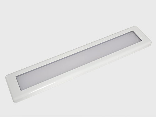 SWIM 24 inch LED engine room light glowing on white background

