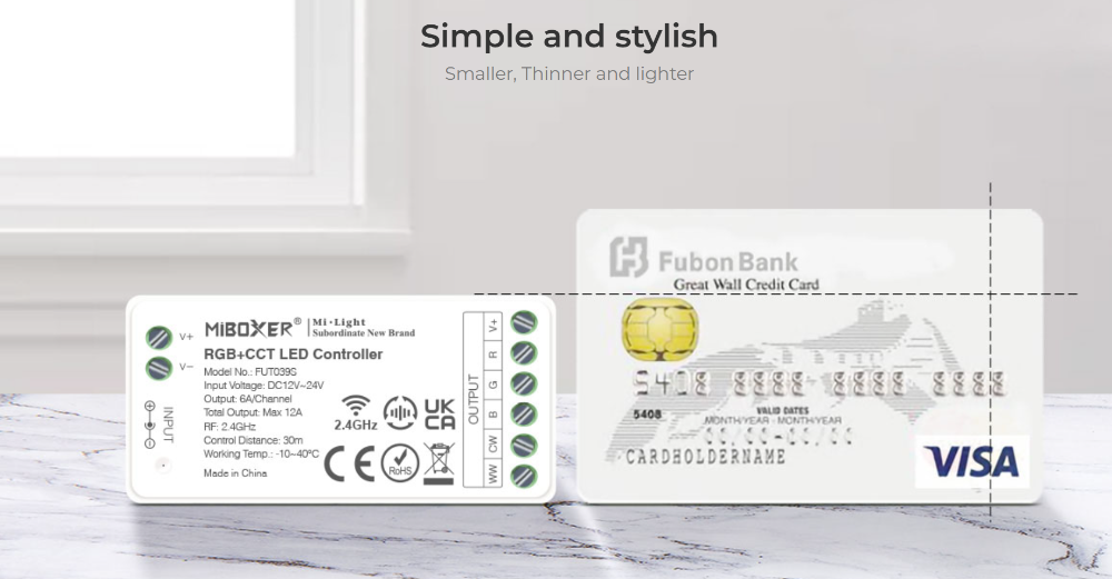 Miboxer RGB+CCT LED strip controller with wireless control next to credit card