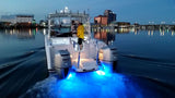 SeaBlaze X3 Spectrum underwater light, 6,000+ lumens, polished installed on center console moving at night.