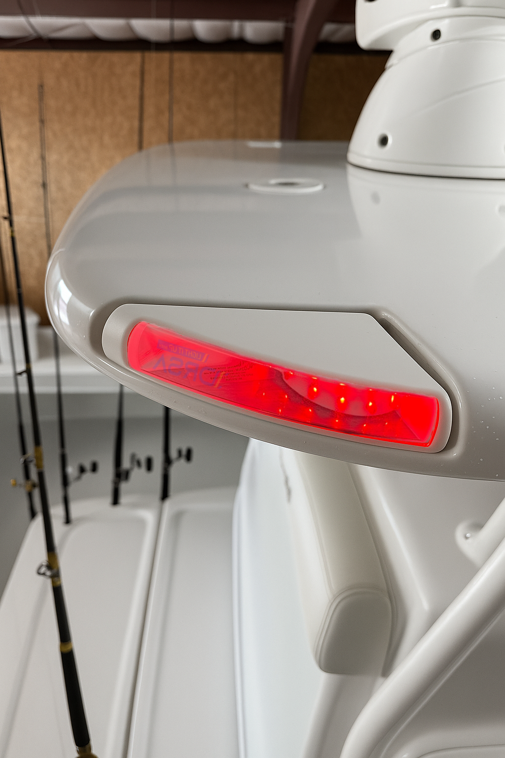 colse up of SI Flush Mount LED Navigation Light – port red  led on seahunter center console light
 at night