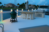 Dock piling cap in white with soft warm white LED glow on white dock

