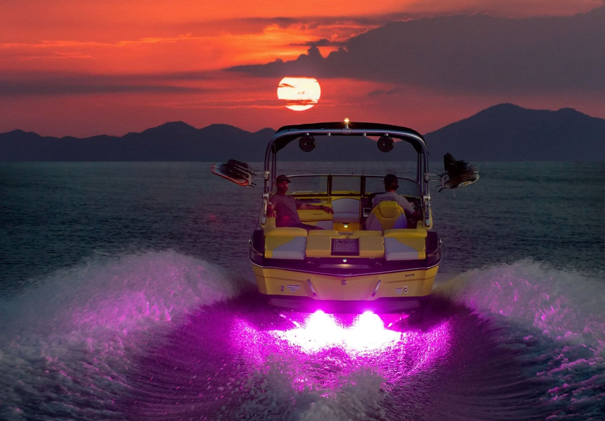 Javelin 600X underwater light, sleek rectangular design, RGBW output installed on wakeboat at sunset pink light