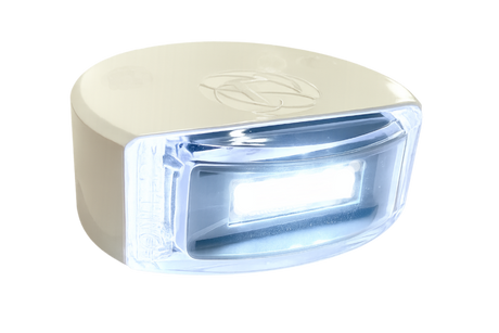 Lumitec Surface Mount Composite Navigation Light Stern White illuminating a boat’s stern at night  101868