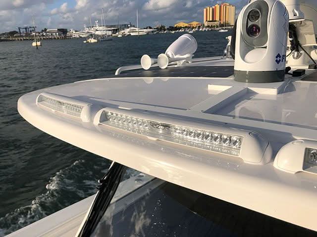 triple Razor LED Light Bar Spot delivering 10,000 lumens, sleek white finish flush-mount design front profile view on centerconsole hardtop