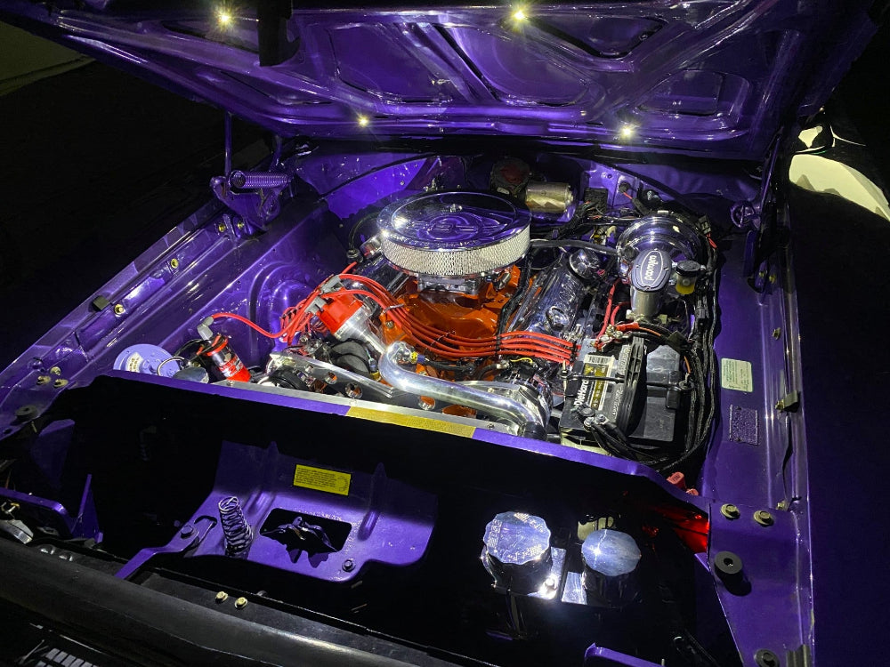 Led bullet light Car engine with a purple hood and visible components custom automotive builds